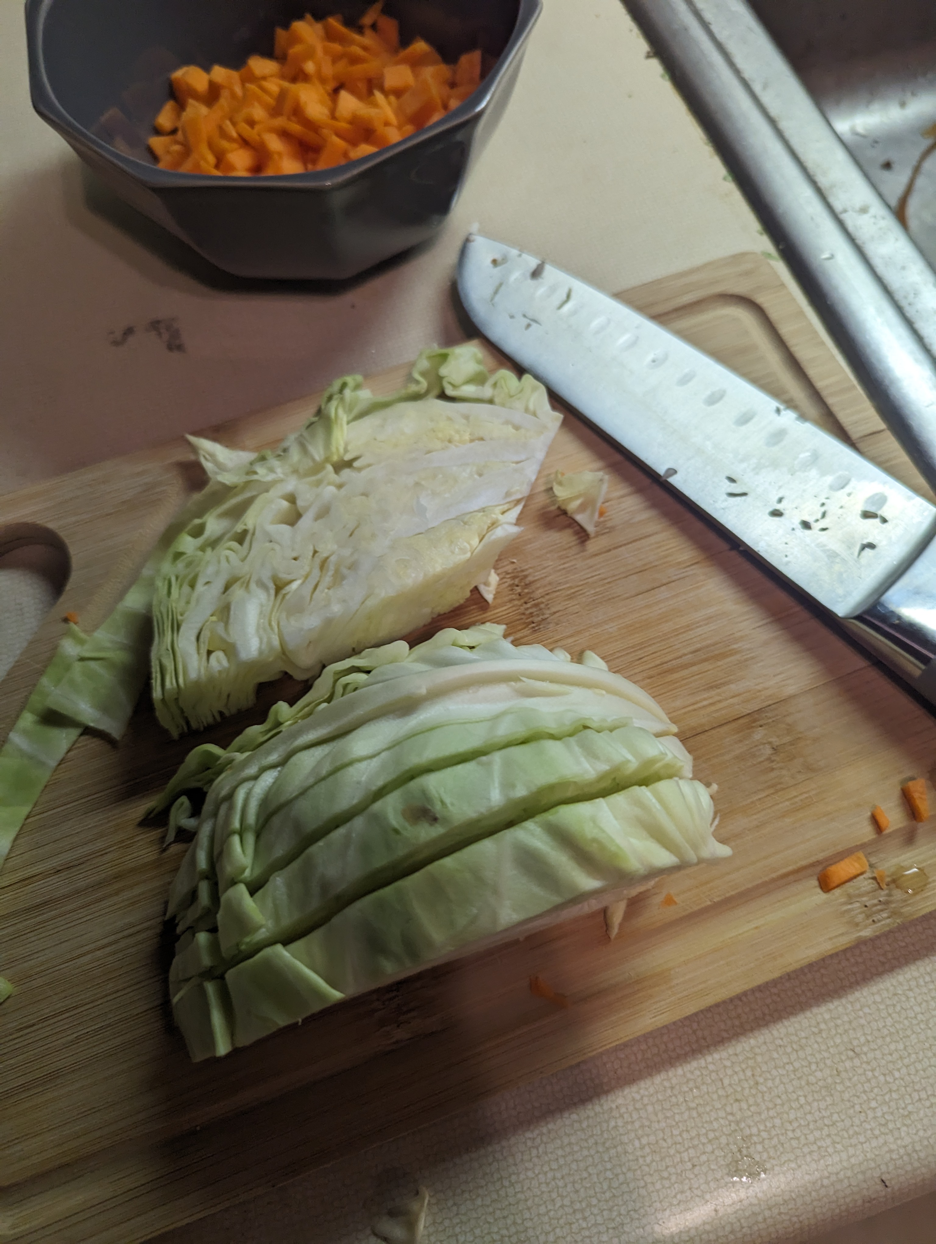 Half a cabbage, half-way through being chopped