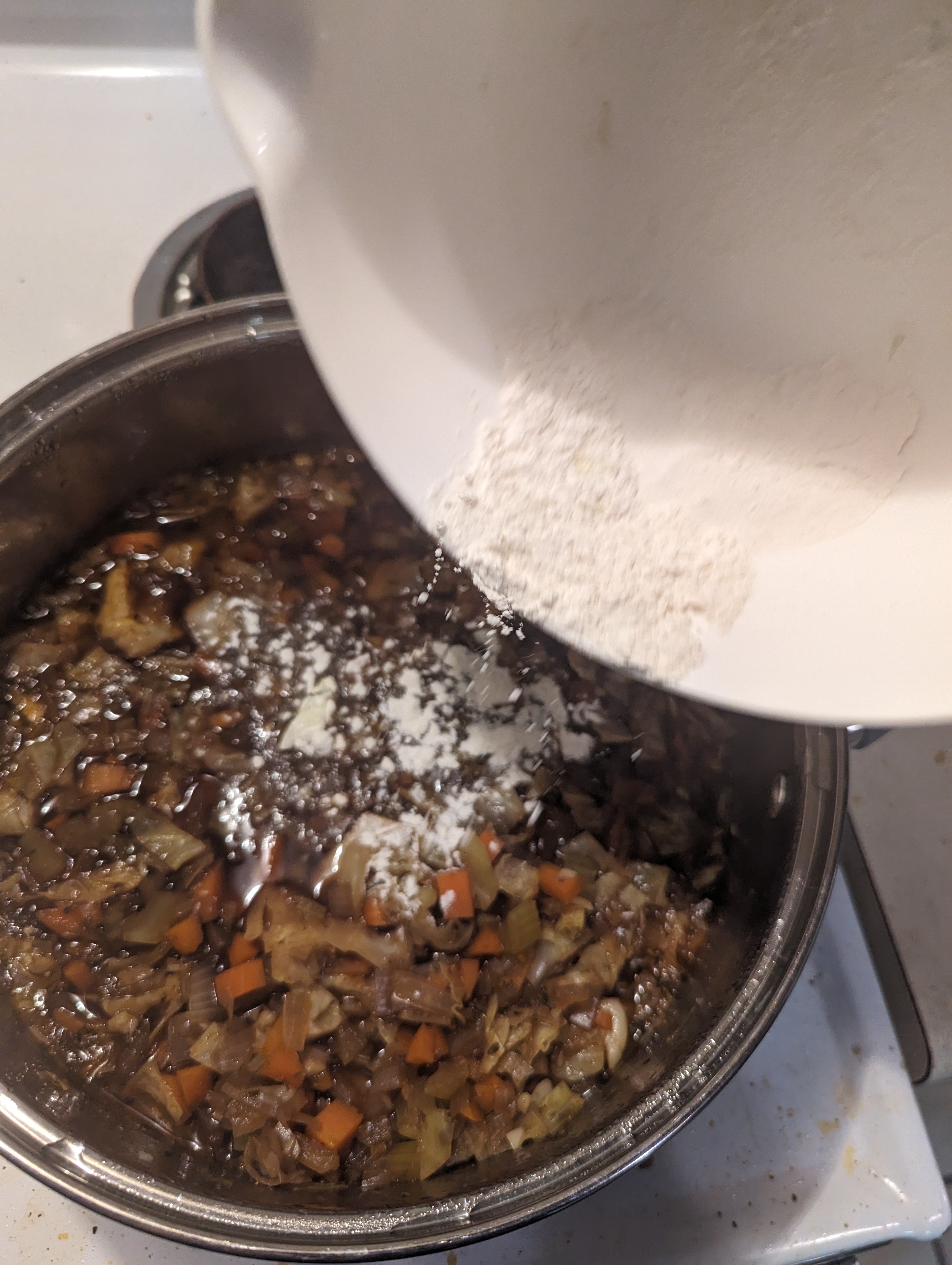 Sprinkling the flour into the stew